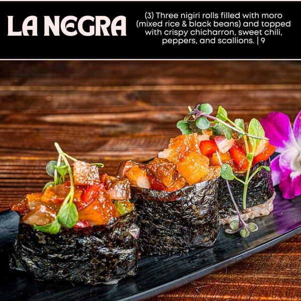 Three nigiri rolls with moro, crispy chicharron, sweet chili, peppers, and scallions on a black plate.