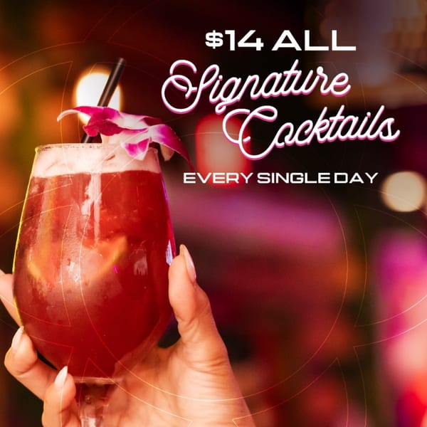 Hand holds a red signature cocktail garnished with a pink flower against a colorful bokeh background advertising $14 cocktails daily.