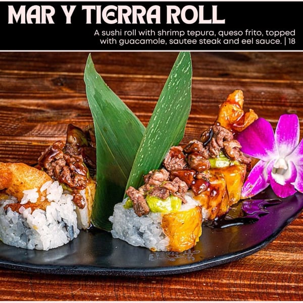 Mar y Tierra sushi roll with shrimp tempura, queso frito, guacamole, steak, and eel sauce.