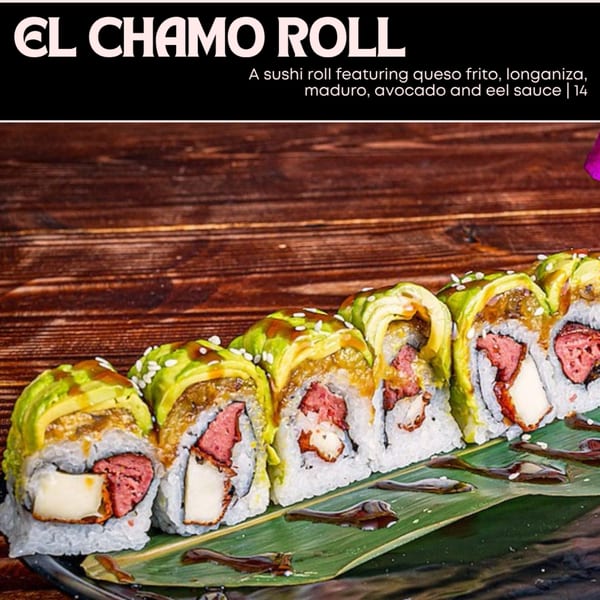El Chamo Roll sushi with queso frito, longaniza, maduro, avocado, and eel sauce on a banana leaf.